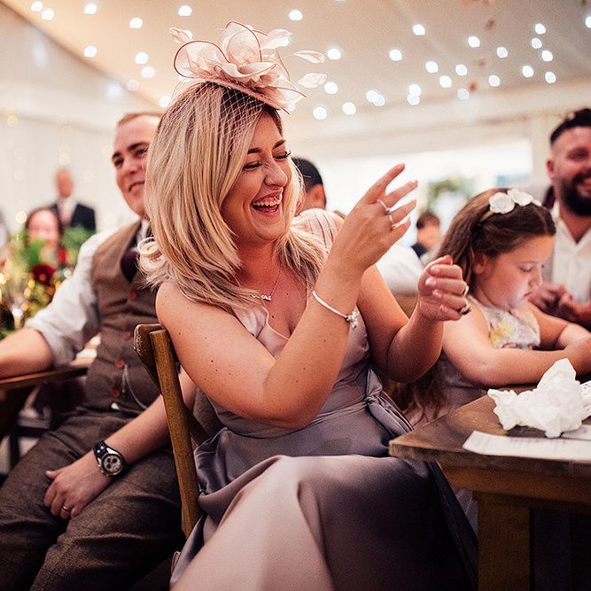 Wedding Guest Laughing During the Wedding Reception Speeches