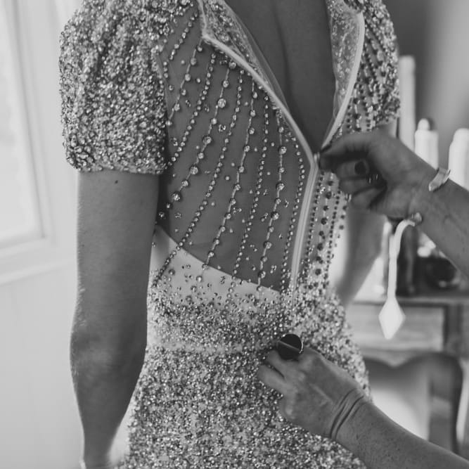 Back of brides embellished wedding dress at winter wedding with sparkles and glamour