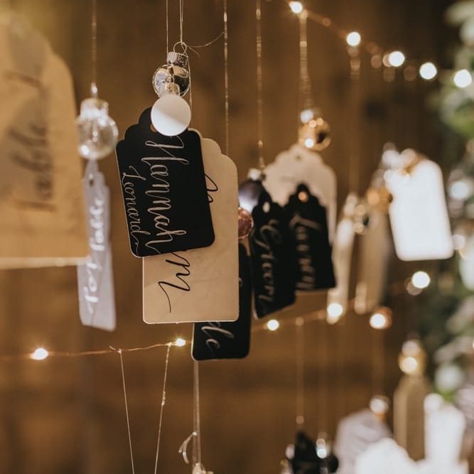 DIY table plan with baubles and fairy lights at winter reception
