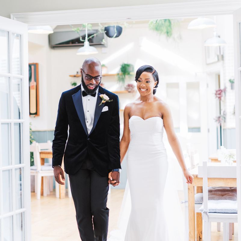 Bride and groom entering the wedding reception  at Deer Park Country House