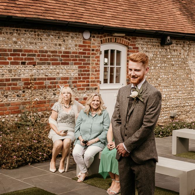 Groom at the altar of socially distanced 2020 wedding