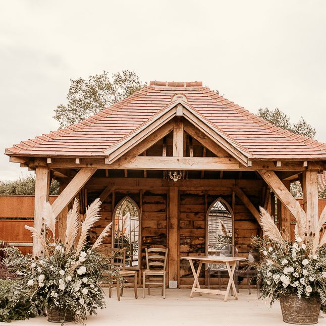 Outdoor pergola at Southend Barns decorated with dried flower arrangement