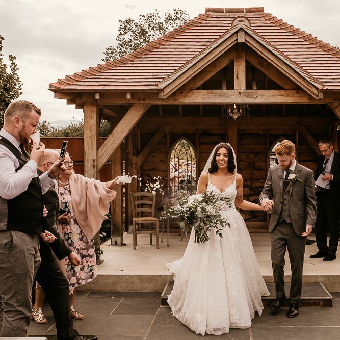 Bride and groom just married at intimate outdoor wedding ceremony
