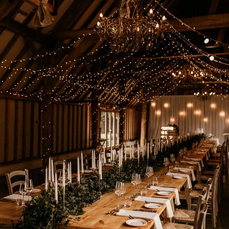 Southend Barns wedding reception with taper candles and fairy lights