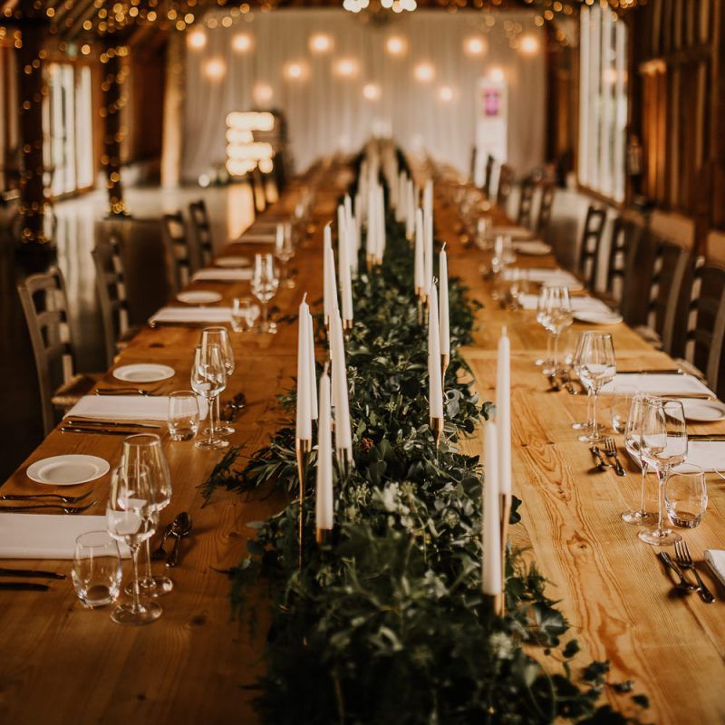 Intimate wedding reception at Southend Barns with rustic decor