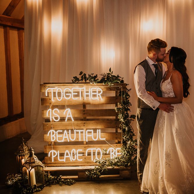 Neon wedding sign at rustic wedding
