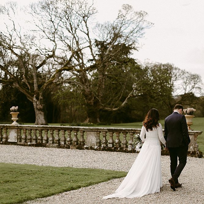 Bride in a Homemade Wedding Dress with Lace Bodice and Long Sleeves, and Groom in Navy Suit