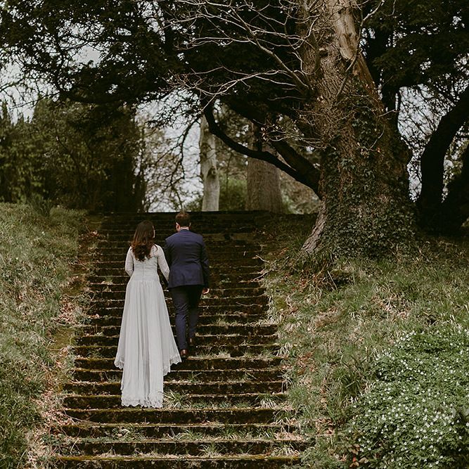 Bride in Homemade Wedding Dress with Lace Long Sleeves and High Neck