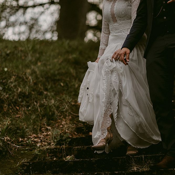 Bride in Homemade Wedding Dress with Lace Long Sleeves and High Neck