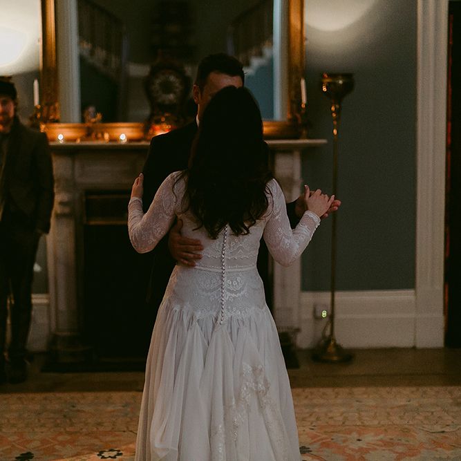 First Dance with Bride in Homemade Wedding Dress with Lace Long Sleeves and High Neck and Groom in Navy Zara Suit