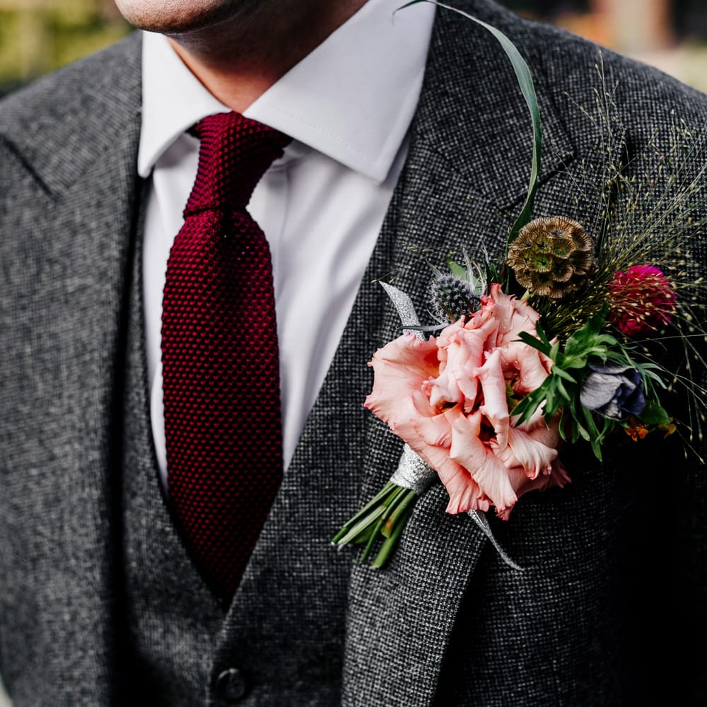 Winter Buttonhole | Colourful Alternative Winter Wedding at Upwaltham Barns, Sussex | Epic Love Story Photography