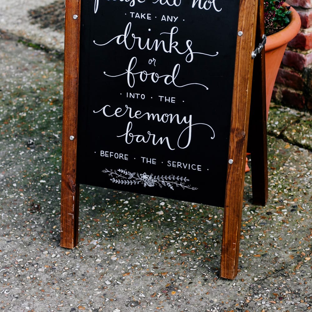 Chalkboard Wedding Sign | Colourful Alternative Winter Wedding at Upwaltham Barns, Sussex | Epic Love Story Photography