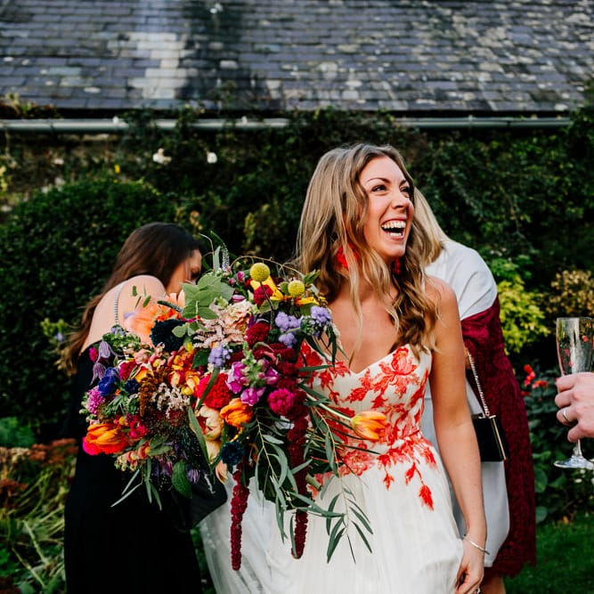 Bride in Red &amp; White Joanne Fleming Design Wedding Dress | Colourful Alternative Winter Wedding at Upwaltham Barns, Sussex | Epic Love Story Photography