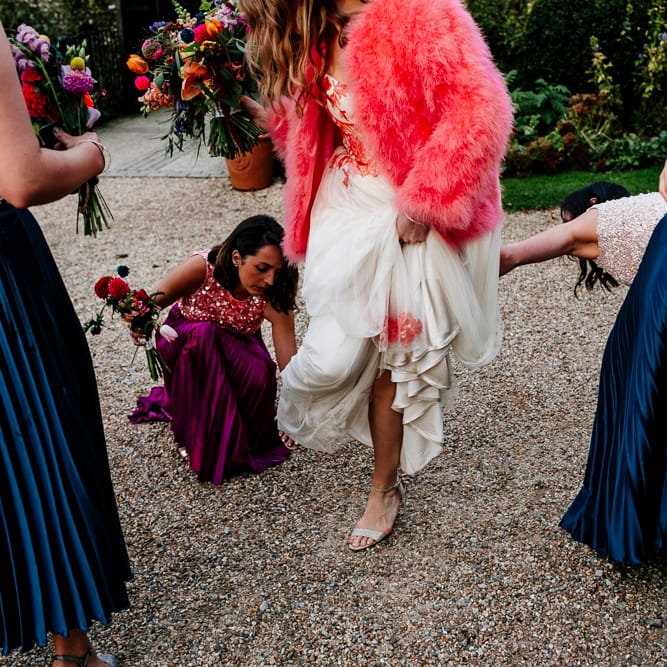 Bride in Red &amp; White Joanne Fleming Design Wedding Dress | Pink Faux Fur Jacket | Bridesmaids in Jewel Coloured Skirts &amp; Sequin Top Separates | Colourful Alternative Winter Wedding at Upwaltham Barns, Sussex | Epic Love Story Photography