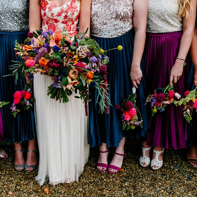 Oversized Bridal Bouquets | Bride in Red &amp; White Joanne Fleming Design Wedding Dress | Bridesmaids in Jewel Coloured Skirts &amp; Sequin Top Separates | Colourful Alternative Winter Wedding at Upwaltham Barns, Sussex | Epic Love Story Photography