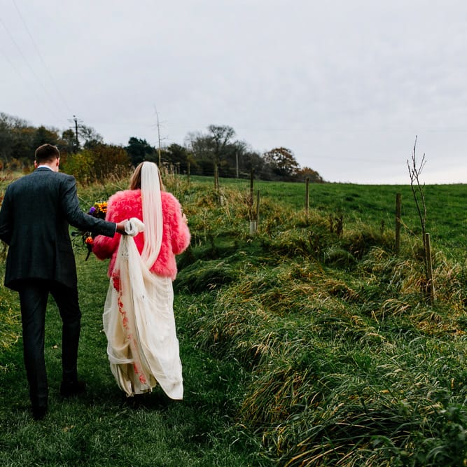 Bride in Red &amp; White Joanne Fleming Design Wedding Dress | Groom in Suit Supply Suit | Colourful Alternative Winter Wedding at Upwaltham Barns, Sussex | Epic Love Story Photography