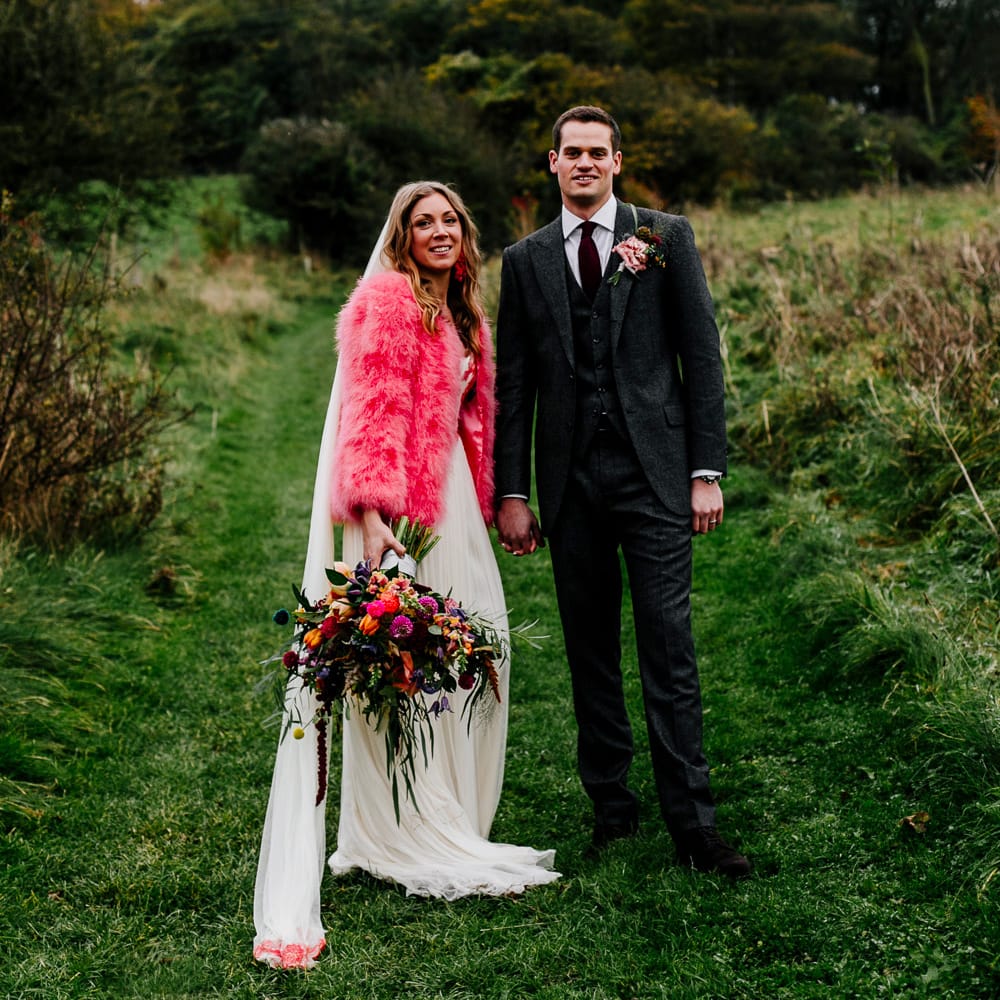 Bride in Red &amp; White Joanne Fleming Design Wedding Dress | Groom in Suit Supply Suit | Colourful Alternative Winter Wedding at Upwaltham Barns, Sussex | Epic Love Story Photography