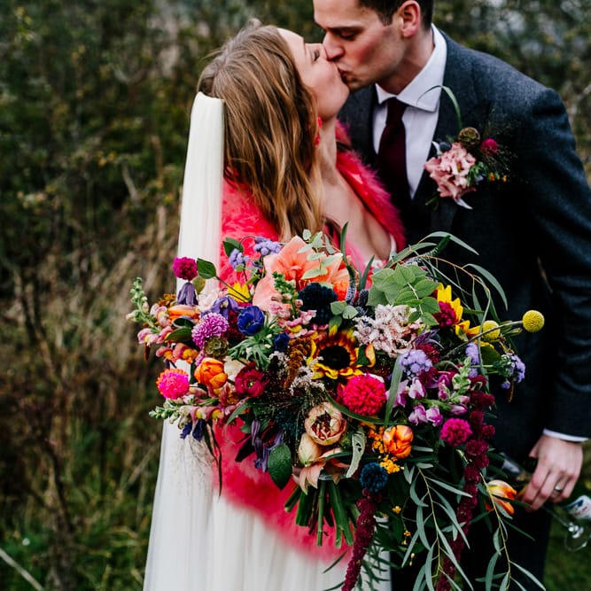 Oversized Bright Bouquets | Bride in Red &amp; White Joanne Fleming Design Wedding Dress | Groom in Suit Supply Suit | Colourful Alternative Winter Wedding at Upwaltham Barns, Sussex | Epic Love Story Photography