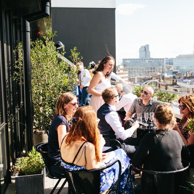 Stylish Rooftop Wedding At Ace Hotel Shoreditch // Image By Story Wedding Photography // Bride In Catherine Deane // Bobbi Brown Bridal