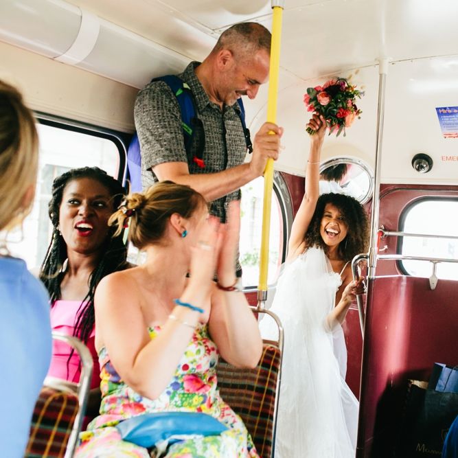 Red Routemaster Bus Wedding Transport // Stylish Rooftop Wedding At Ace Hotel Shoreditch // Image By Story Wedding Photography // Bride In Catherine Deane // Bobbi Brown Bridal