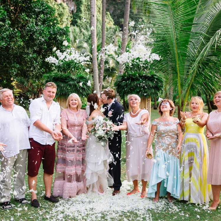 Bride and groom portrait with their family