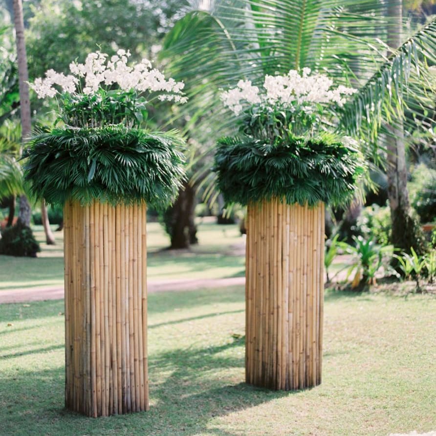 Tall plinth altar flowers for outdoor tropical wedding in Thailand