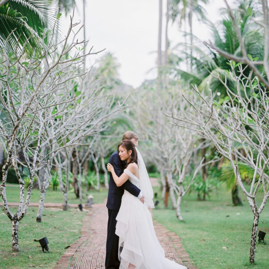 Bride and groom portrait with bride in organza wedding dress