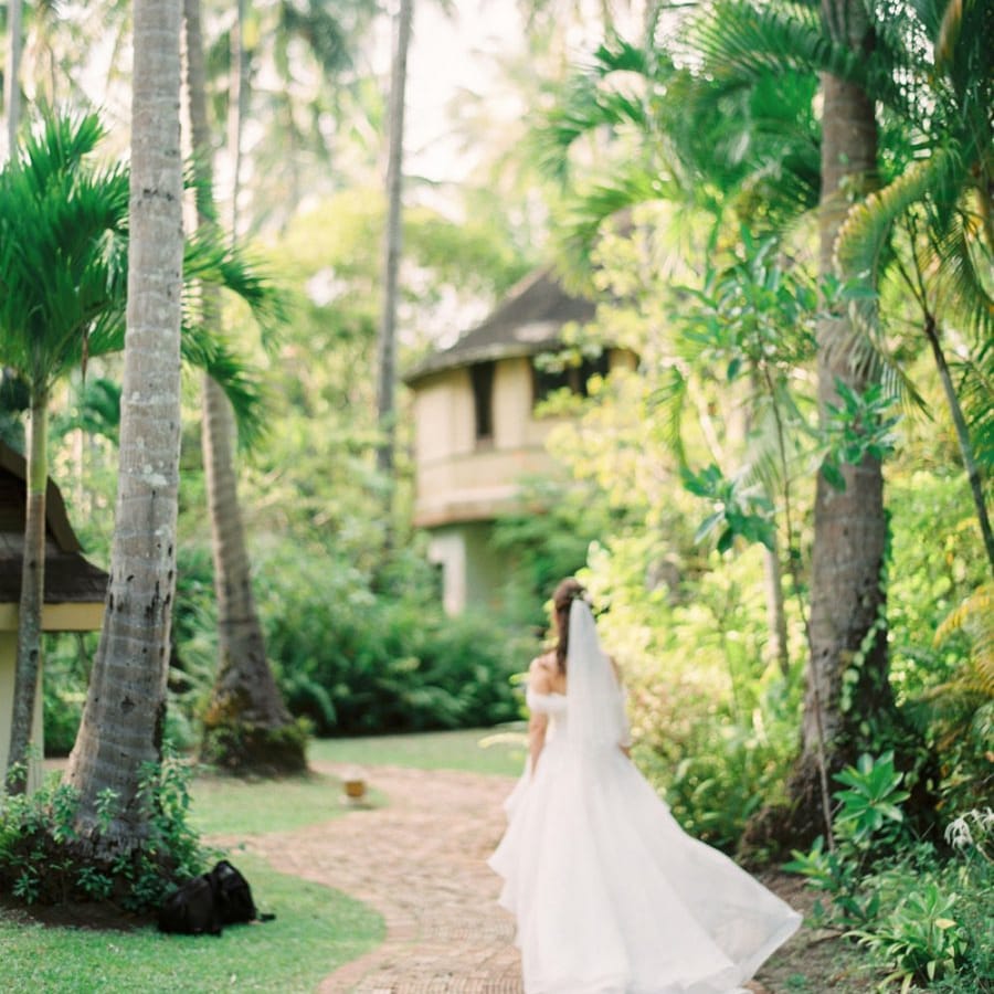 Bride in organza wedding dress at Tropical wedding