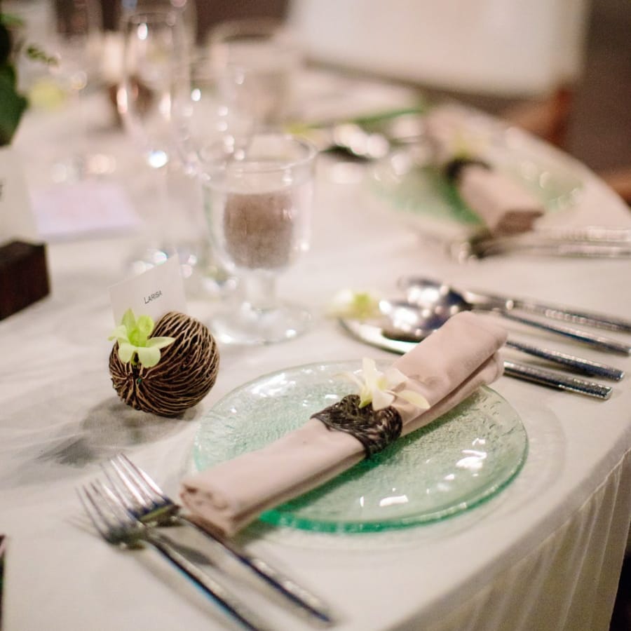 Place setting with green glass plates and napkins