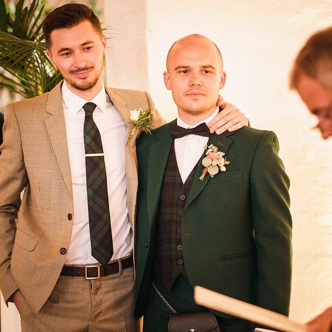 Grooms listen to wedding readings