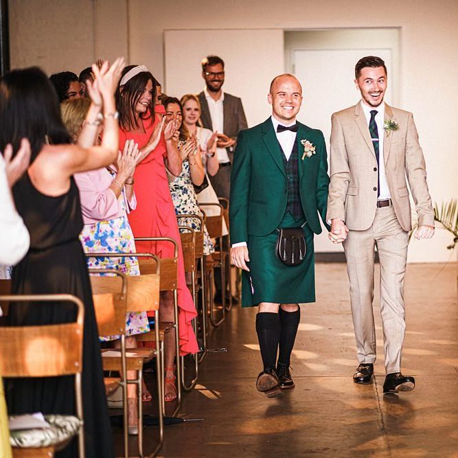Groom in kilt walking down the aisle