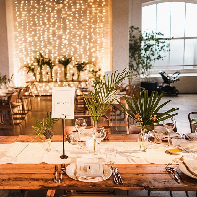 Wedding table decor with palm leaf decor