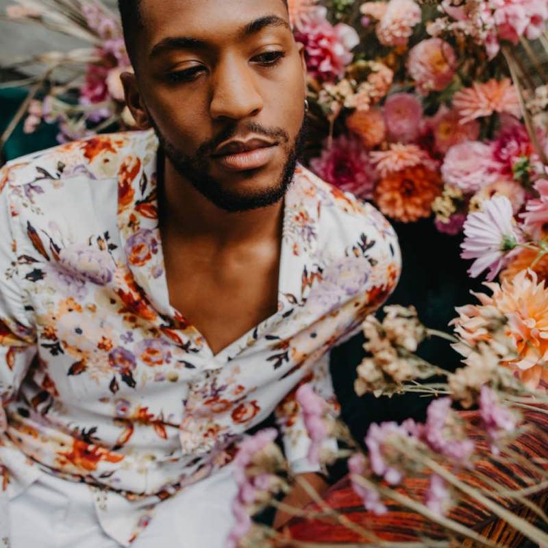 Groom in floral shirt for tropical wedding inspiration