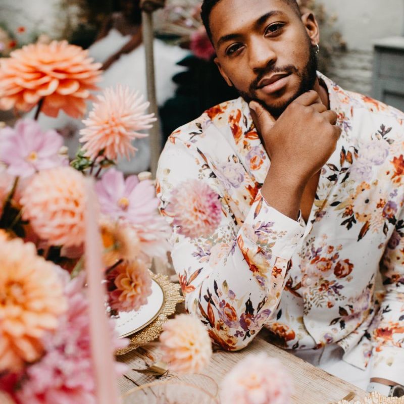 Groom in floral shirt at intimate wedding