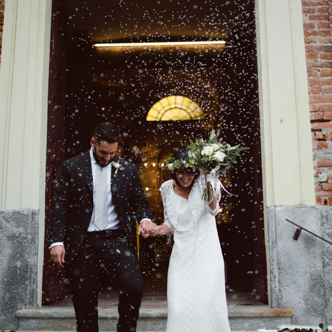 Confetti Moment | Bride in Laure De Sagazan Gown | Groom in Black Suit | Green &amp; White Bohemian Wedding in the Rain at Castello di San Sebastiano da Po, Italy | Margherita Calati Photography | Second Shooter Carlo Vittorio