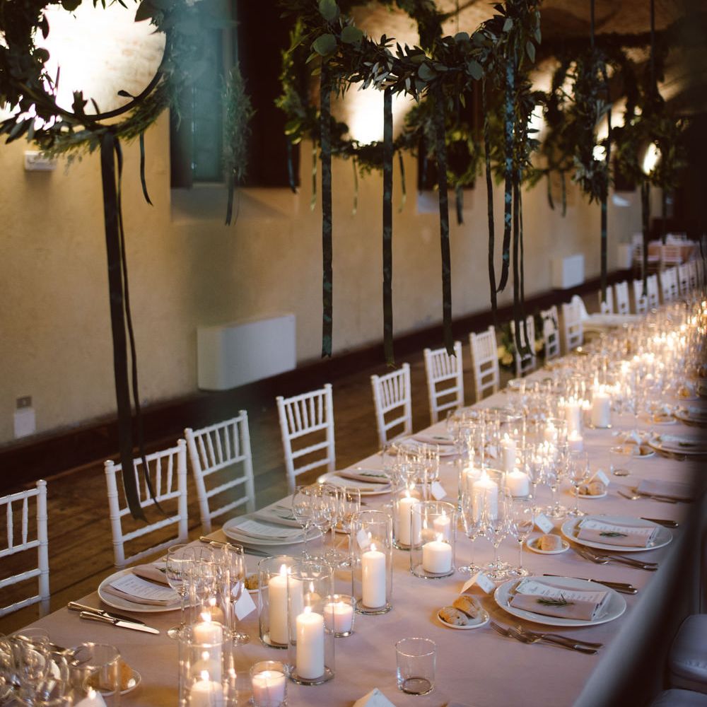 Greenery Hanging Hoops &amp; Candle Light Wedding Reception Decor | Green &amp; White Bohemian Wedding in the Rain at Castello di San Sebastiano da Po, Italy | Margherita Calati Photography | Second Shooter Carlo Vittorio