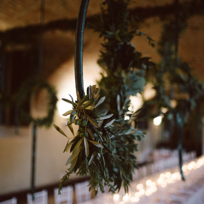 Greenery Hanging Hoops &amp; Candle Light Wedding Reception Decor | Green &amp; White Bohemian Wedding in the Rain at Castello di San Sebastiano da Po, Italy | Margherita Calati Photography | Second Shooter Carlo Vittorio