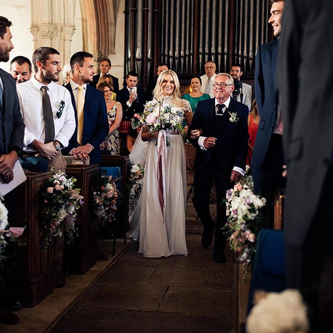 Church wedding ceremony bridal entrance in Julio Vino wedding dress