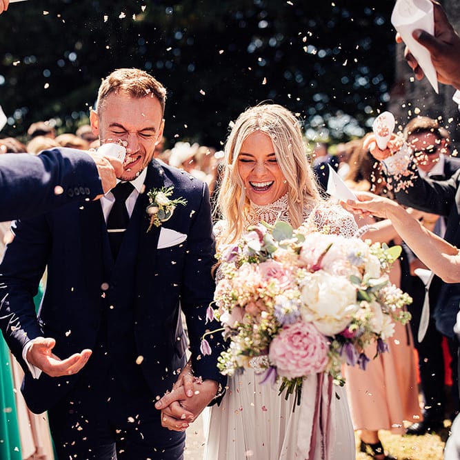 Confetti moment by Harry Michael Photography for wedding with outdoor first dance