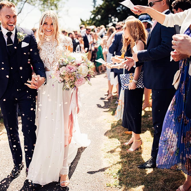 Confetti moment with bride in Julio Vino wedding dress