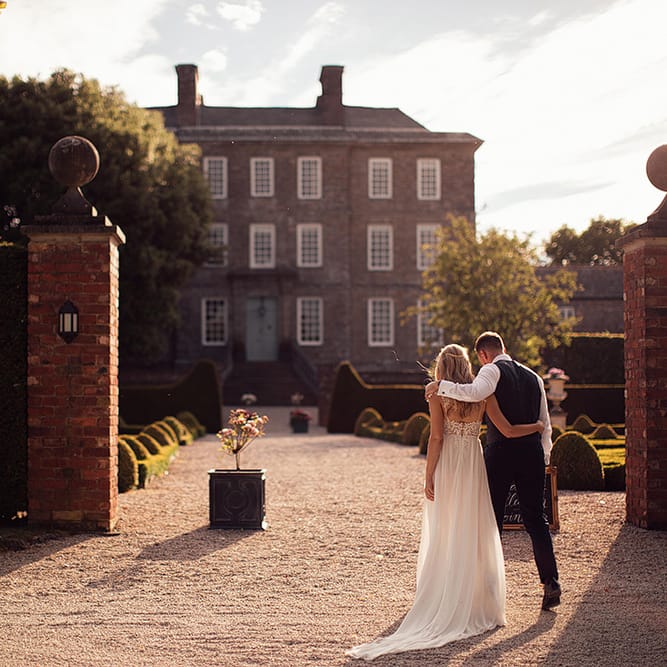 Bride and groom portrait outside their Kingston Estate wedding venue
