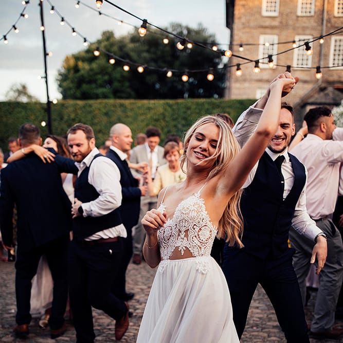 Bride in Julio Vino wedding dress for outdoor wedding first dance