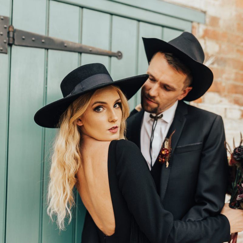 Bride and groom in hats