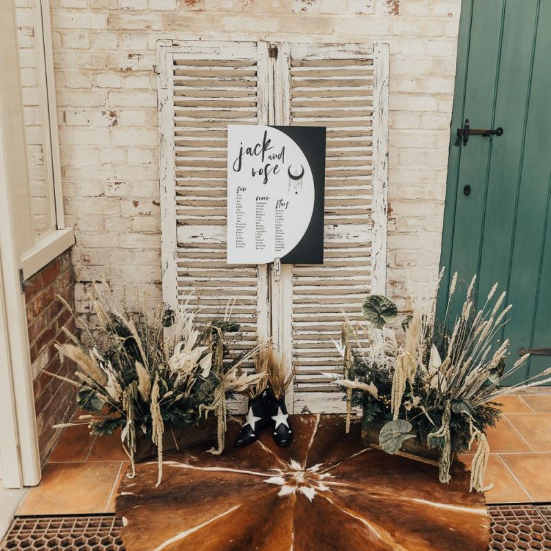 Table plan with shutters, faux fur skins and dried grasses