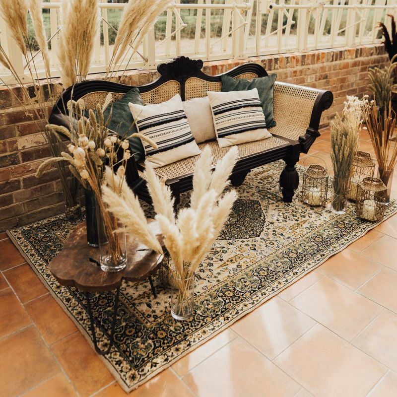 Seating area at intimate glasshouse wedding with western theme