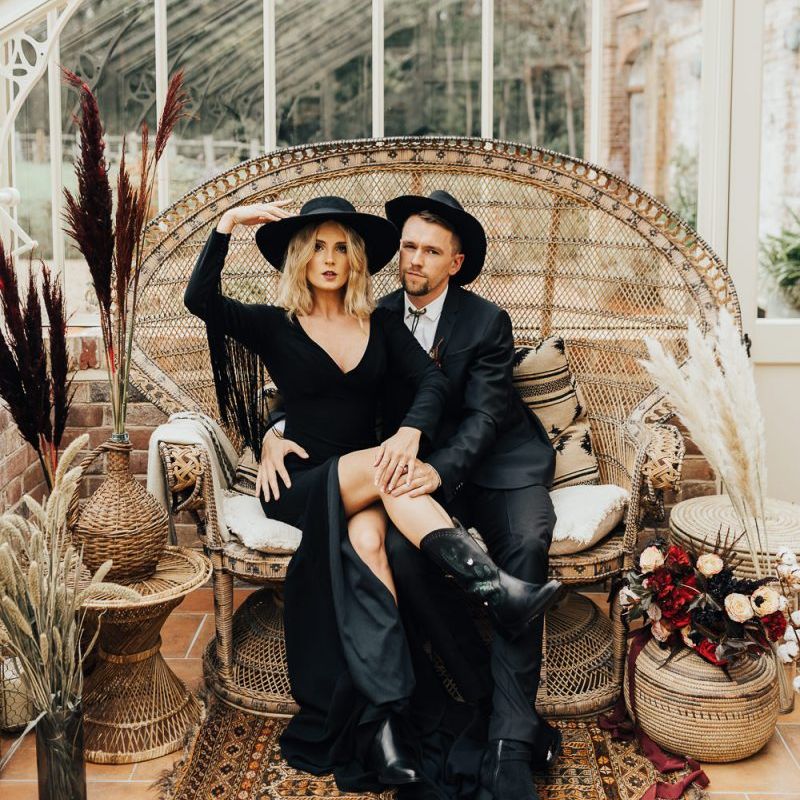 Bride and groom in non traditional western wedding outfits