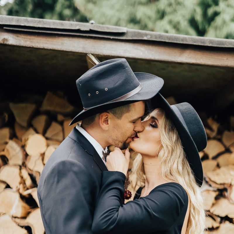 Bride in black wedding dress with fringe sleeve detail
