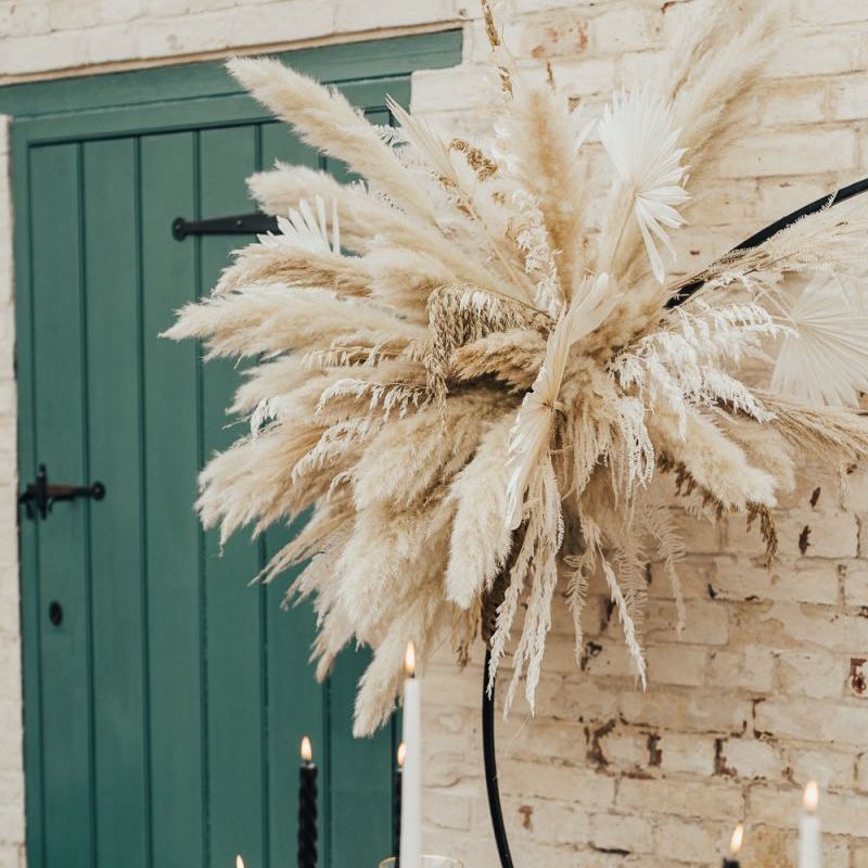 western wedding decor with pampas grass, cactus and gold candlesticks