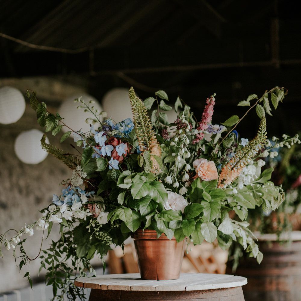 Potted Plant with Pastel Flowers and Hanging Paper Lanterns