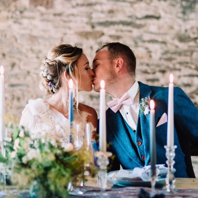 Elegant Tablescape with Blue Taper Candles, Linens &amp; Flowers | Bride in Ghost Wedding Dress | Groom in Navy The Vintage Suit Hire Co. Suit | Wild Coastal Elopement, Bridal Inspiration at New Barton Barns, Devon | Liberty Pearl Photography &amp; Film